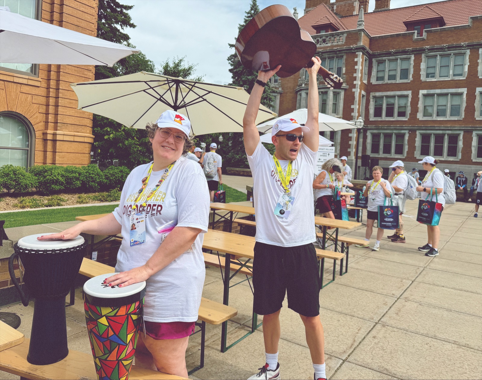 Athletes playing hand drums at the Special Olympics music activation